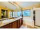Bathroom featuring double sinks, granite countertops, and natural light at 3412 Crystal Tower St, Las Vegas, NV 89129