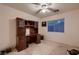 Bedroom features a desk with a ceiling fan and neutral carpet at 3412 Crystal Tower St, Las Vegas, NV 89129