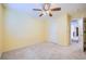 Neutral bedroom with a ceiling fan and a door leading to another room at 3412 Crystal Tower St, Las Vegas, NV 89129
