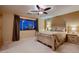 Comfortable bedroom with neutral decor, including a ceiling fan and bedside tables at 3412 Crystal Tower St, Las Vegas, NV 89129
