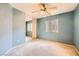 Bedroom featuring neutral carpet, natural light, and ample closet space at 3412 Crystal Tower St, Las Vegas, NV 89129