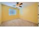 Bedroom with a ceiling fan, neutral carpet and natural light from the window at 3412 Crystal Tower St, Las Vegas, NV 89129