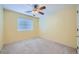 Cozy bedroom featuring a ceiling fan and a window with blinds at 3412 Crystal Tower St, Las Vegas, NV 89129