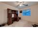 Home office with built-in desk, overhead storage, and a large window at 3412 Crystal Tower St, Las Vegas, NV 89129