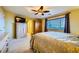 Bedroom with bed and dresser and a window offering natural light, carpet floors, ceiling fan and lighting at 3412 Crystal Tower St, Las Vegas, NV 89129