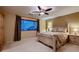 Serene bedroom featuring a comfortable bed, matching nightstand, and large window at 3412 Crystal Tower St, Las Vegas, NV 89129