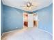 Bedroom featuring a ceiling fan, a door to bathroom, and another door to hall at 3412 Crystal Tower St, Las Vegas, NV 89129