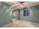 Bright bedroom with mirrored closet doors, fan, and neutral carpet at 3412 Crystal Tower St, Las Vegas, NV 89129