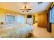 Bright bedroom with carpet floors, fan, a large window, and matching furniture at 3412 Crystal Tower St, Las Vegas, NV 89129
