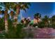 Scenic city skyline view at dusk, framed by palm trees, offering a glimpse of vibrant city lights at 3412 Crystal Tower St, Las Vegas, NV 89129