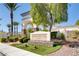 Inviting entrance to Shadow Hills Club with stone signage, manicured landscaping, and arched entryway at 3412 Crystal Tower St, Las Vegas, NV 89129