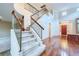 Inviting home entrance featuring a staircase with wooden and iron banisters, leading to a spacious, light-filled foyer at 3412 Crystal Tower St, Las Vegas, NV 89129