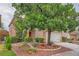 Charming home with landscaped front yard, well-maintained lawn, trees, and a two-car garage at 3412 Crystal Tower St, Las Vegas, NV 89129
