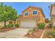 Charming two-story home featuring a two-car garage, desert landscaping, and a tile roof at 3412 Crystal Tower St, Las Vegas, NV 89129