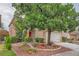 Well-maintained home with mature landscaping, a spacious driveway, and an attached two-car garage at 3412 Crystal Tower St, Las Vegas, NV 89129
