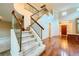 A spacious foyer with carpeted staircase, hardwood floors, high ceilings, and access to the front door at 3412 Crystal Tower St, Las Vegas, NV 89129