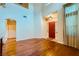 Inviting foyer featuring hardwood floors and a bright red front door at 3412 Crystal Tower St, Las Vegas, NV 89129
