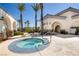 Relaxing hot tub area surrounded by palm trees and well-maintained landscaping at 3412 Crystal Tower St, Las Vegas, NV 89129