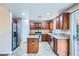 Modern kitchen with stainless steel appliances, granite countertops, and tile floors at 3412 Crystal Tower St, Las Vegas, NV 89129