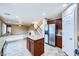 Open kitchen boasts stainless steel appliances, granite counters, and a center island at 3412 Crystal Tower St, Las Vegas, NV 89129
