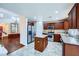 Open kitchen boasts stainless steel appliances, granite counters, and a center island at 3412 Crystal Tower St, Las Vegas, NV 89129