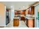 Well-lit kitchen with an island, granite countertops, stainless steel appliances and light tile floors at 3412 Crystal Tower St, Las Vegas, NV 89129