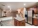 Spacious kitchen with an island that flows into the living area and staircase at 3412 Crystal Tower St, Las Vegas, NV 89129