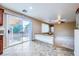 Bright kitchen with access to the backyard patio through sliding glass doors; open floor plan extends into the cozy living area at 3412 Crystal Tower St, Las Vegas, NV 89129