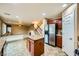 Open kitchen with granite counters, stainless appliances, and view to second-story living room at 3412 Crystal Tower St, Las Vegas, NV 89129