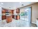 Well-lit kitchen featuring granite countertops, stainless steel appliances, and a view of the backyard through sliding glass doors at 3412 Crystal Tower St, Las Vegas, NV 89129