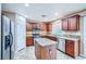 Contemporary kitchen featuring a functional island, stainless steel appliances, and granite countertops for style and efficiency at 3412 Crystal Tower St, Las Vegas, NV 89129