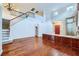Spacious living room featuring hardwood floors, staircase, and entry door at 3412 Crystal Tower St, Las Vegas, NV 89129
