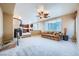 Living room with great light, carpet, and adjacent to kitchen at 3412 Crystal Tower St, Las Vegas, NV 89129