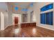 Inviting living room features high ceilings, hardwood floors, and a striking red front door at 3412 Crystal Tower St, Las Vegas, NV 89129