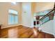 Spacious living room featuring hardwood floors and staircase access to upper level at 3412 Crystal Tower St, Las Vegas, NV 89129