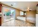 An open concept living room that has sliding glass doors leading to a backyard patio at 3412 Crystal Tower St, Las Vegas, NV 89129