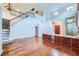 Open-concept living space with hardwood floors, tall ceilings, and a stylish built-in cabinet, perfect for entertaining guests at 3412 Crystal Tower St, Las Vegas, NV 89129
