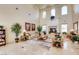 Grand living room with high ceilings, fireplace, and elegant furnishings at 3412 Crystal Tower St, Las Vegas, NV 89129