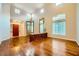 Open-concept living room with hardwood floors, soaring ceilings and bright, natural lighting at 3412 Crystal Tower St, Las Vegas, NV 89129