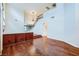 Bright living room with high ceilings, hardwood floors, and open staircase with a chandelier at 3412 Crystal Tower St, Las Vegas, NV 89129