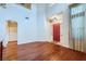 Spacious living room featuring wood floors, high ceilings, recessed lights and a bright red entry door at 3412 Crystal Tower St, Las Vegas, NV 89129