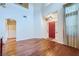 Spacious living room with hardwood floors and a red front door at 3412 Crystal Tower St, Las Vegas, NV 89129