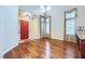 Spacious living room with hardwood floors, high ceilings, and a red front door at 3412 Crystal Tower St, Las Vegas, NV 89129