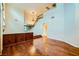 Open-concept living room showcasing hardwood floors, staircase, and elegant chandelier at 3412 Crystal Tower St, Las Vegas, NV 89129
