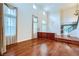 Elegant living room with high ceilings, hardwood floors, and large windows with decorative curtains at 3412 Crystal Tower St, Las Vegas, NV 89129