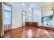 Bright and airy living room featuring hardwood floors and tall windows, showcasing the home's blend of space and natural light at 3412 Crystal Tower St, Las Vegas, NV 89129