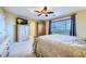 This beautiful bedroom features a large window, carpeted floors, a ceiling fan, and stylish decor at 3412 Crystal Tower St, Las Vegas, NV 89129