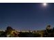 Home view at night presents city lights under a starry sky, enhanced by rooftop details at 3412 Crystal Tower St, Las Vegas, NV 89129