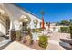 Outdoor patio area with comfortable seating, umbrellas, and a built-in grill at 3412 Crystal Tower St, Las Vegas, NV 89129