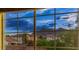 A window view of the community showcasing the mountain range and neighborhood houses at 3412 Crystal Tower St, Las Vegas, NV 89129